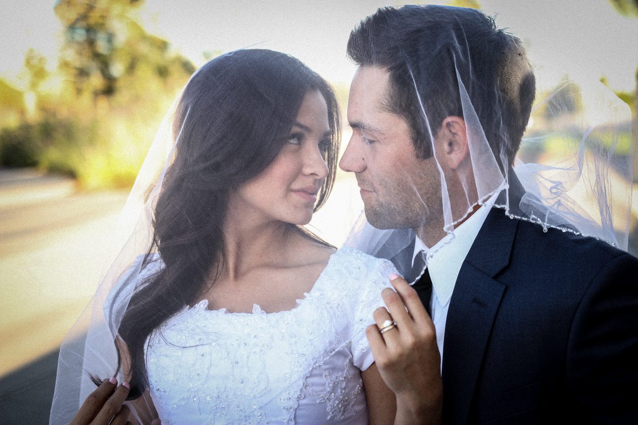 Bride and groom under bride's veil at the Gilbert Arizona Temple