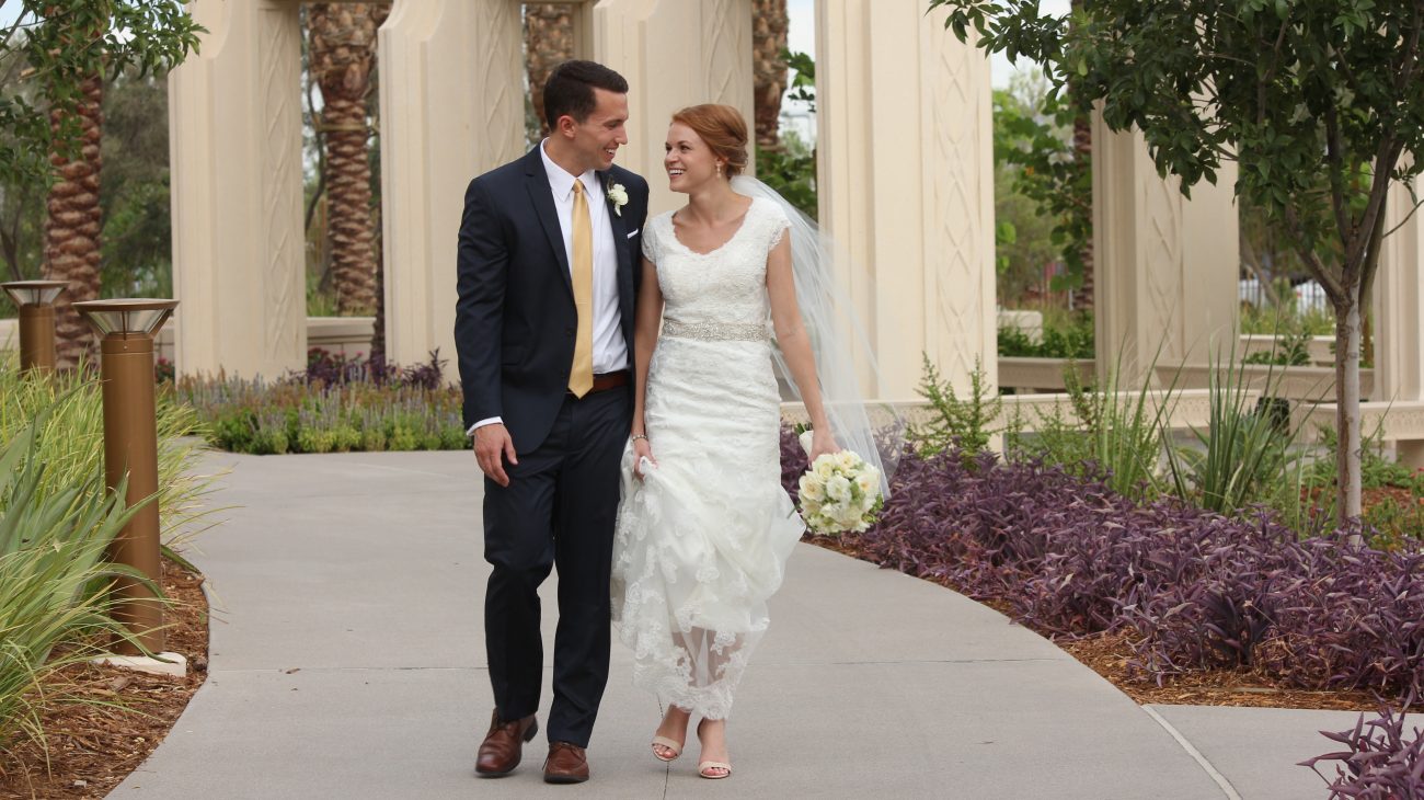 Candid walking photo of bride and groom at the Gilbert Arizona Temple