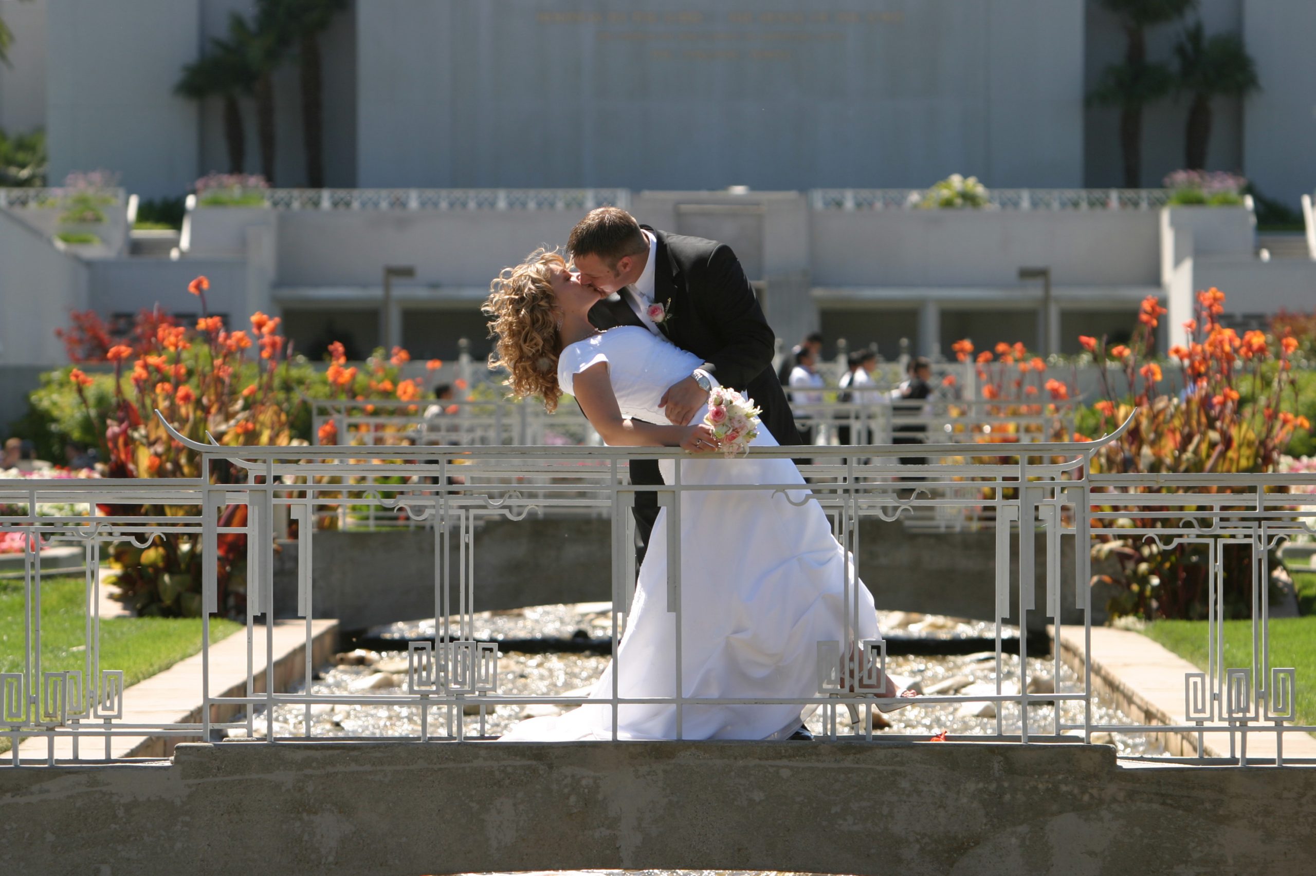 Bride and groom dipping kiss photo at the Oakland Temple