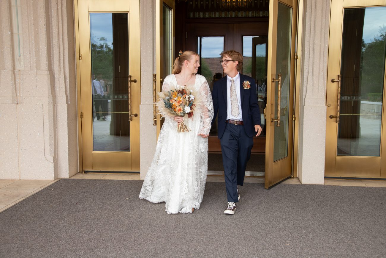 Bride and groom exiting the Phoenix Arizona Temple after their sealing