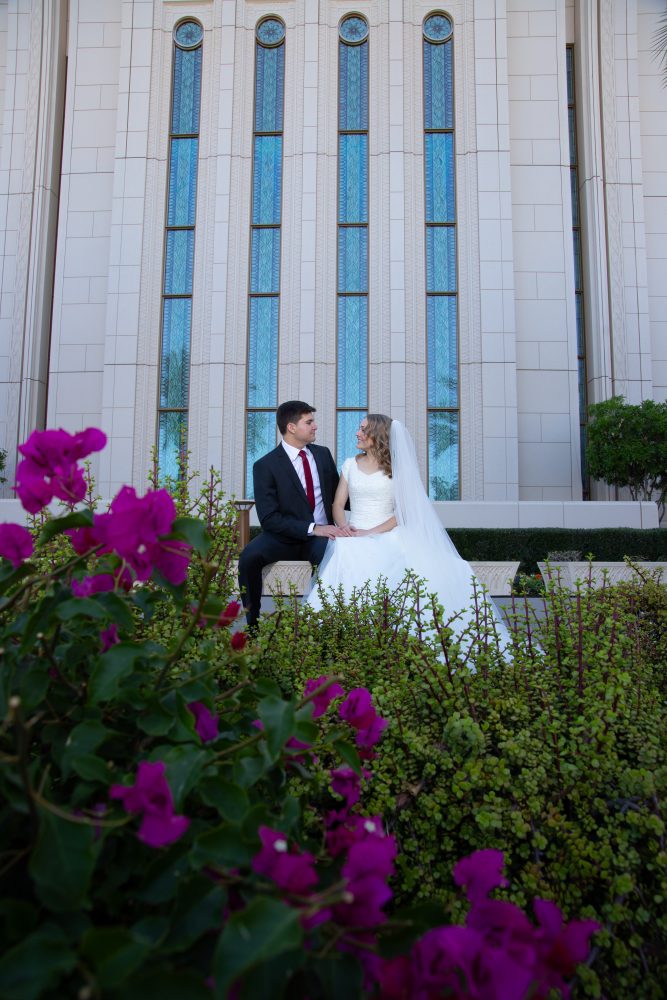 Bride and groom with flowers at the Gilbert Temple