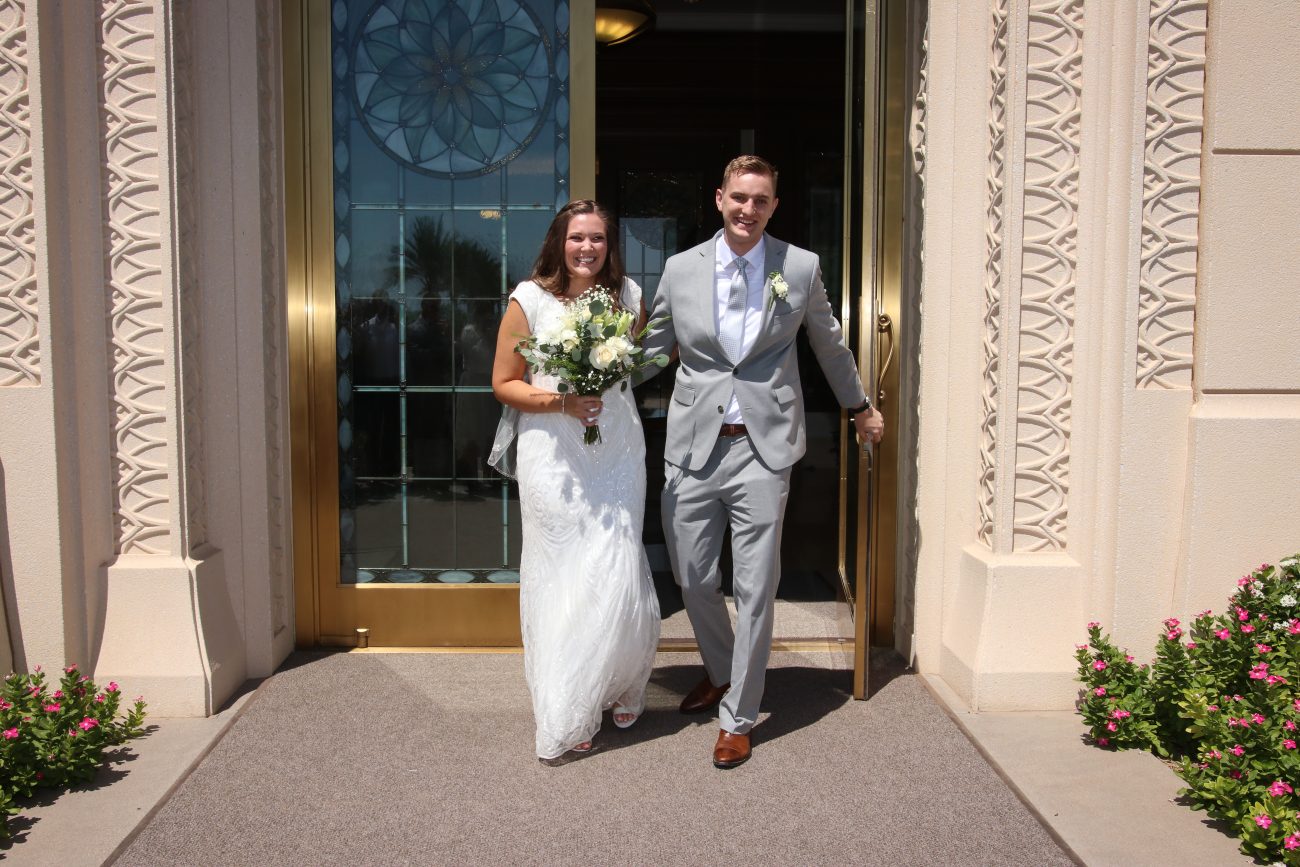 Bride and groom Morgan and Treyson exit the Gilbert Temple after the wedding