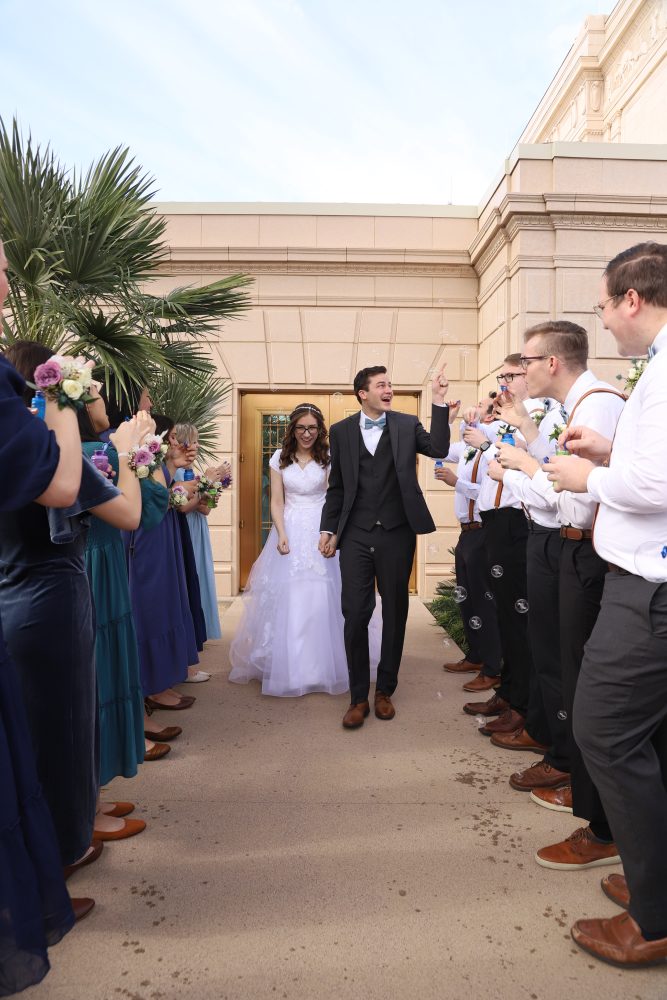 Bride and groom greet their family after the wedding outside of the Mesa Arizona Temple