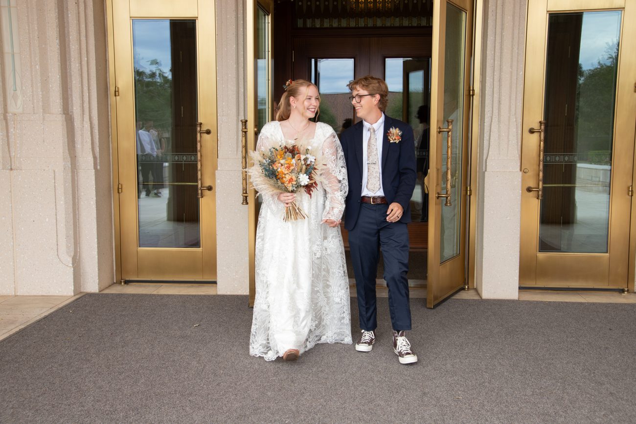 At the Phoenix Arizona Temple with the newlyweds right after the wedding. Bride and groom sharing a look with each other.