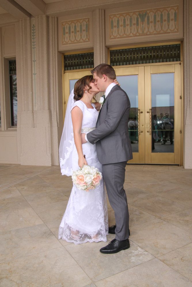 Bride and groom share a first kiss at the Phoenix Arizona Temple.