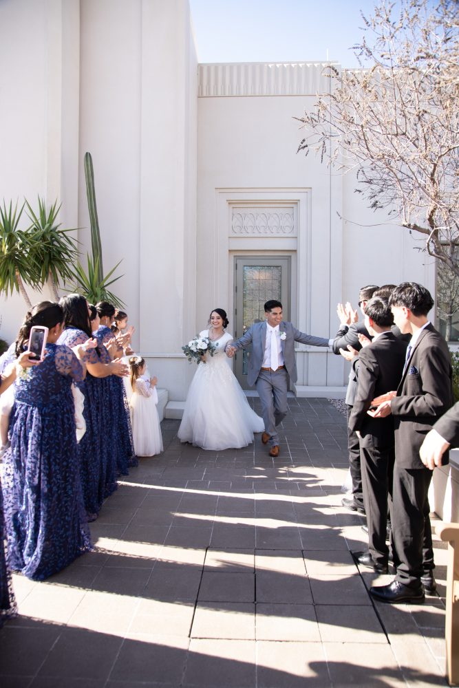 Bride and groom greet family at the Tucson Temple after the wedding