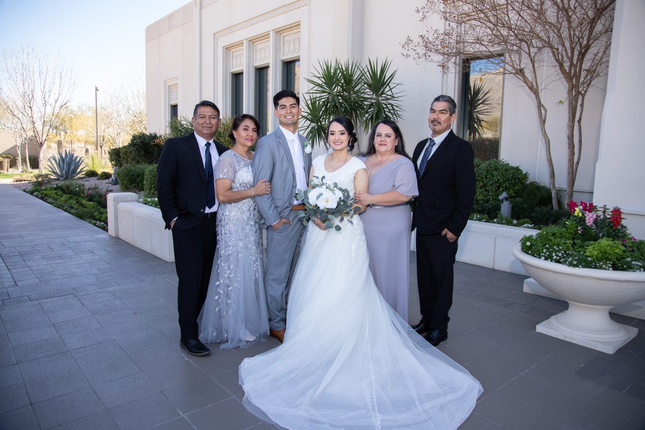 Tucson Arizona Temple wedding photo with family on the North east side of the temple.