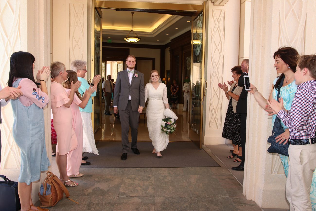 Bride and groom exiting the Gilbert Temple after the wedding. Northeast side exit of the Gilbert Temple.