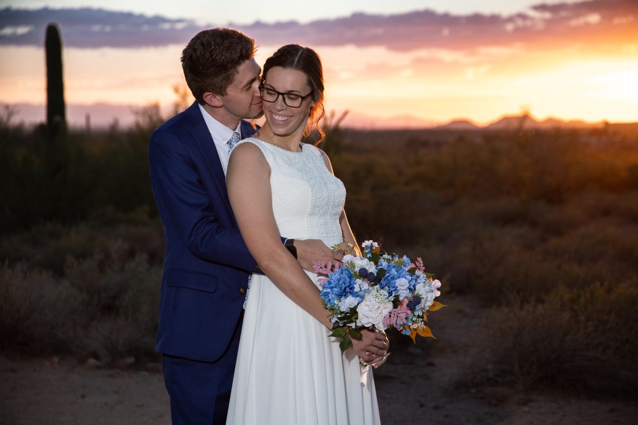 Bride and groom portrait at sunset.