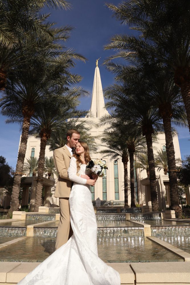 Bride and groom standing in front of the Gilbert Arizona Temple