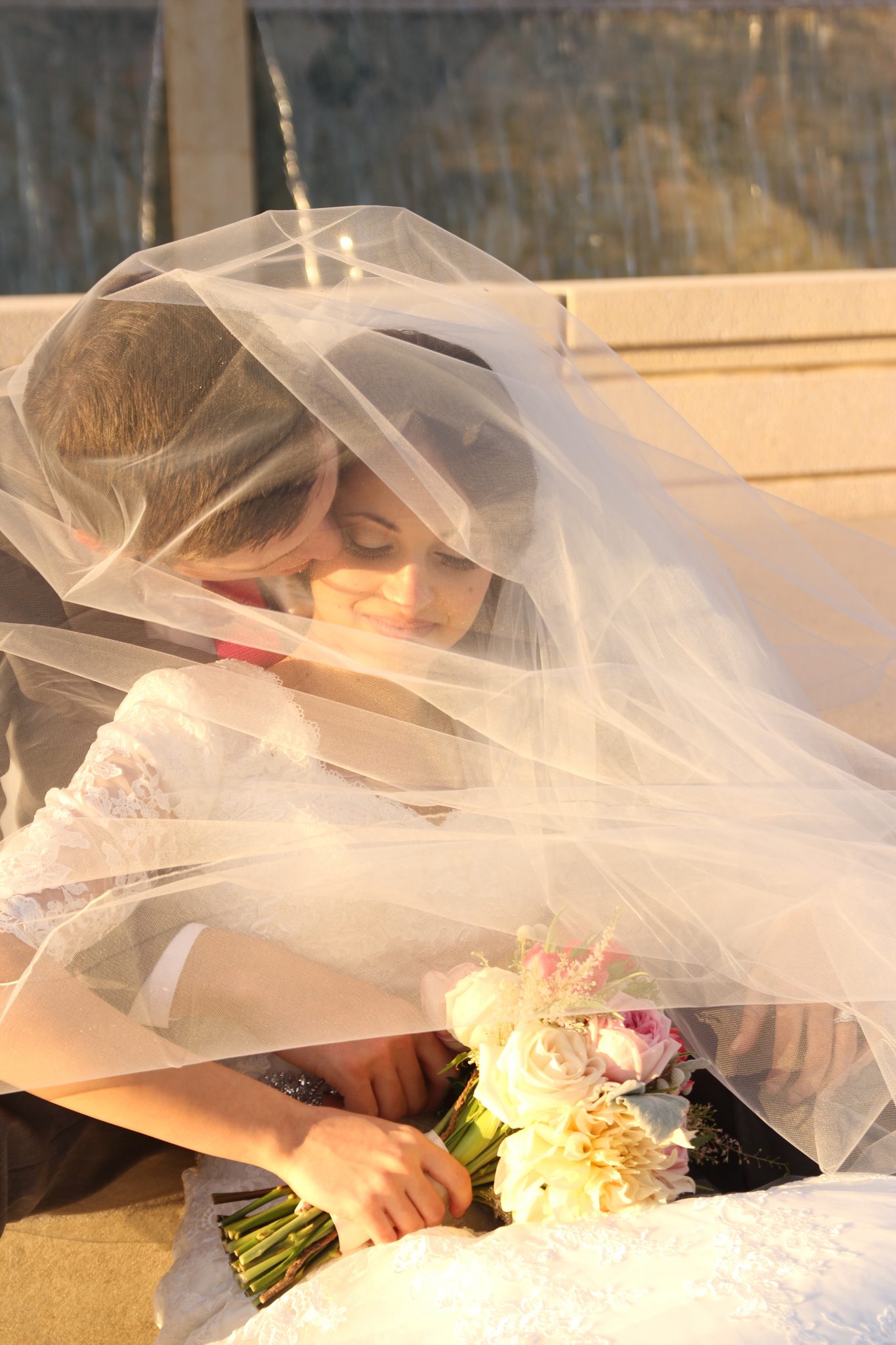 Bride and groom under veil Gilbert Temple Wedding Photographer